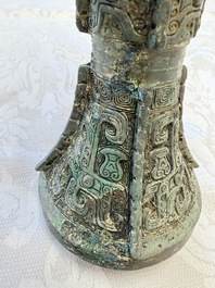 A Chinese archaic bronze wine vessel with Taotie design, Gu 觚, Shang