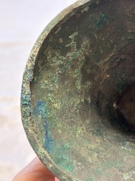 A Chinese archaic bronze wine vessel with Taotie design, Gu 觚, Shang