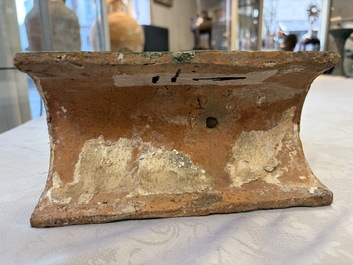 A pair of Chinese sancai-glazed 'Horseriders' roof tiles on wooden stands, Ming