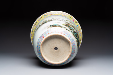 A Chinese famille rose 'Mountainous Landscape' jardiniere with a stand and a pair of vases with floral design, Qianlong marks, 20th C.