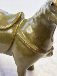 A Chinese teadust-glazed model of a horse on a wooden stand, Republic
