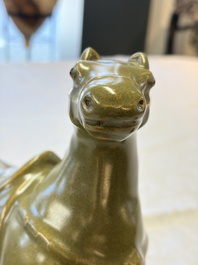A Chinese teadust-glazed model of a horse on a wooden stand, Republic