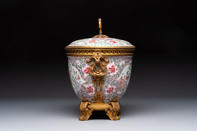 A gilt-bronze mounted famille rose-style covered bowl and two vases, one with cover, Samson, Paris, 19th C.