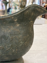 A rare and large Chinese archaistic bronze pouring vessel and cover, Gong 觥, Qing