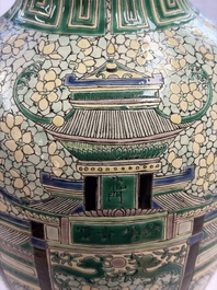 A Chinese verte biscuit 'Dragon Gate Carp 鯉躍龍門' vase on a wooden stand, Xuande mark, 19th C.