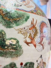 A pair of Chinese famille rose '18 Luohan' vases and covers, 19th C.