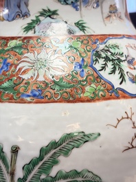 A pair of Chinese famille rose '18 Luohan' vases and covers, 19th C.