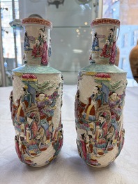 A pair of Chinese famille rose relief-moulded 'Immortals' vases, Qianlong mark, Republic