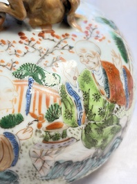 A pair of Chinese famille rose '18 Luohan' vases and covers, 19th C.
