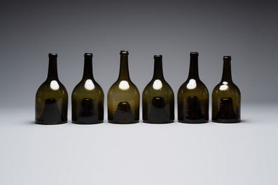 A set of six dark green glass mallet-shaped bottles, possibly France or England, 19th C. or earlier