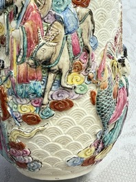 A pair of Chinese famille rose relief-moulded 'Immortals' vases, Qianlong mark, Republic