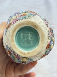 A pair of Chinese famille rose relief-moulded 'Immortals' vases, Qianlong mark, Republic