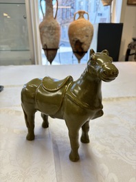A Chinese teadust-glazed model of a horse on a wooden stand, Republic