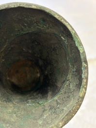 A Chinese archaic bronze wine vessel with Taotie design, Gu 觚, Shang