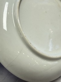 A fine Chinese Canton famille rose cup and saucer with figural design, Yongzheng/Qianlong