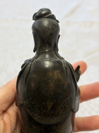 A Chinese bronze standing Guanyin with boy, Ming