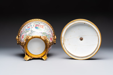 A gilt-bronze mounted famille rose-style covered bowl and two vases, one with cover, Samson, Paris, 19th C.