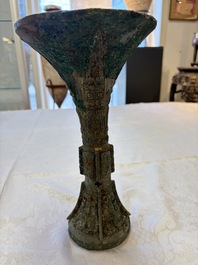 A Chinese archaic bronze wine vessel with Taotie design, Gu 觚, Shang