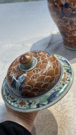 A Chinese blue, white and iron-red decorated 'Mythical Animals' vase and cover, 19th C.