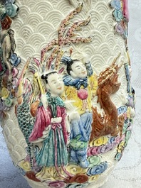 A pair of Chinese famille rose relief-moulded 'Immortals' vases, Qianlong mark, Republic