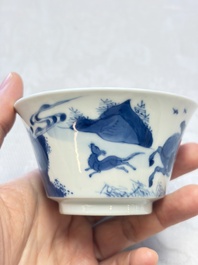 A Chinese blue and white 'Hunting Scene' cup and saucer, Kangxi