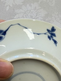 A Chinese blue and white 'Hunting Scene' cup and saucer, Kangxi