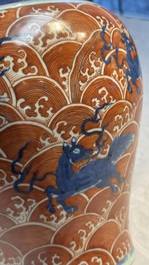 A Chinese blue, white and iron-red decorated 'Mythical Animals' vase and cover, 19th C.