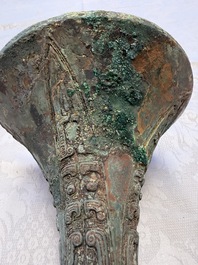 A Chinese archaic bronze wine vessel with Taotie design, Gu 觚, Shang