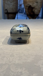 A Chinese blue and white betel nut box and cover with floral design, Wanli