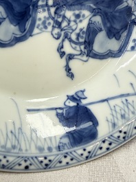 A Chinese blue and white 'Hunting Scene' cup and saucer, Kangxi