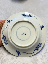 A Chinese blue and white 'Hunting Scene' cup and saucer, Kangxi