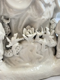 A pair of Chinese Dehua blanc de Chine groups of Guanyin with a child and servants, 18th C.