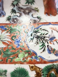 A pair of Chinese famille rose '18 Luohan' vases and covers, 19th C.