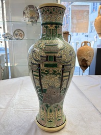A Chinese verte biscuit 'Dragon Gate Carp 鯉躍龍門' vase on a wooden stand, Xuande mark, 19th C.