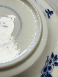 A Chinese blue and white 'Hunting Scene' cup and saucer, Kangxi