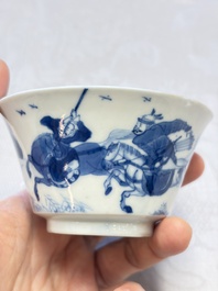 A Chinese blue and white 'Hunting Scene' cup and saucer, Kangxi