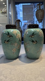 A pair of fine Chinese famille verte turquoise-ground 'Magpie and Prunus' jars with reticulated wooden covers, 19th C.