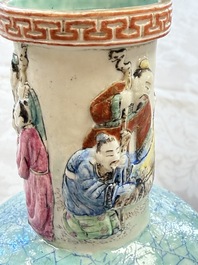 A pair of Chinese famille rose relief-moulded 'Immortals' vases, Qianlong mark, Republic