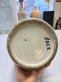 A pair of Chinese famille rose '18 Luohan' vases and covers, 19th C.
