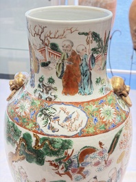 A pair of Chinese famille rose '18 Luohan' vases and covers, 19th C.