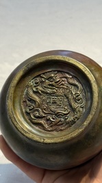 A Chinese bronze censer with lion-head handles and relief dragon design, Lu Gu Zhai 侶古齋 mark, 18/19th C.