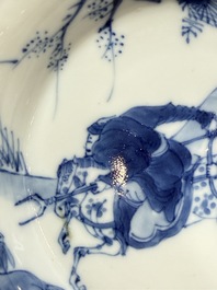 A Chinese blue and white 'Hunting Scene' cup and saucer, Kangxi