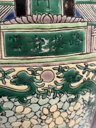 A Chinese verte biscuit 'Dragon Gate Carp 鯉躍龍門' vase on a wooden stand, Xuande mark, 19th C.