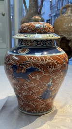 A Chinese blue, white and iron-red decorated 'Mythical Animals' vase and cover, 19th C.