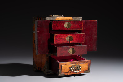 A group of eleven Chinese decorative objects, including bronze, cloisonn&eacute;, wood, and silk, 20th C.