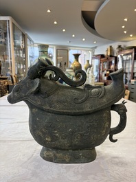A rare and large Chinese archaistic bronze pouring vessel and cover, Gong 觥, Qing