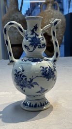 A Chinese blue and white 'Floral' ewer, Transitional period