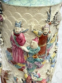 A pair of Chinese famille rose relief-moulded 'Immortals' vases, Qianlong mark, Republic