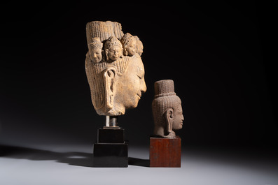 A Khmer-style carved stone head and a carved stone head of a deity, Thailand and Cambodia, 20th C. or earlier