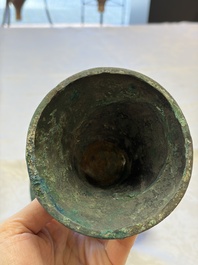 A Chinese archaic bronze wine vessel with Taotie design, Gu 觚, Shang